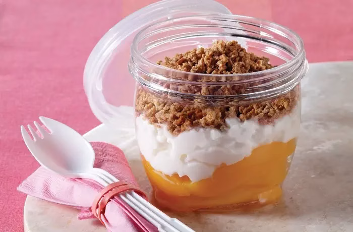 a canned peach, cottage cheese and Grape-Nut cereal parfait in a jar